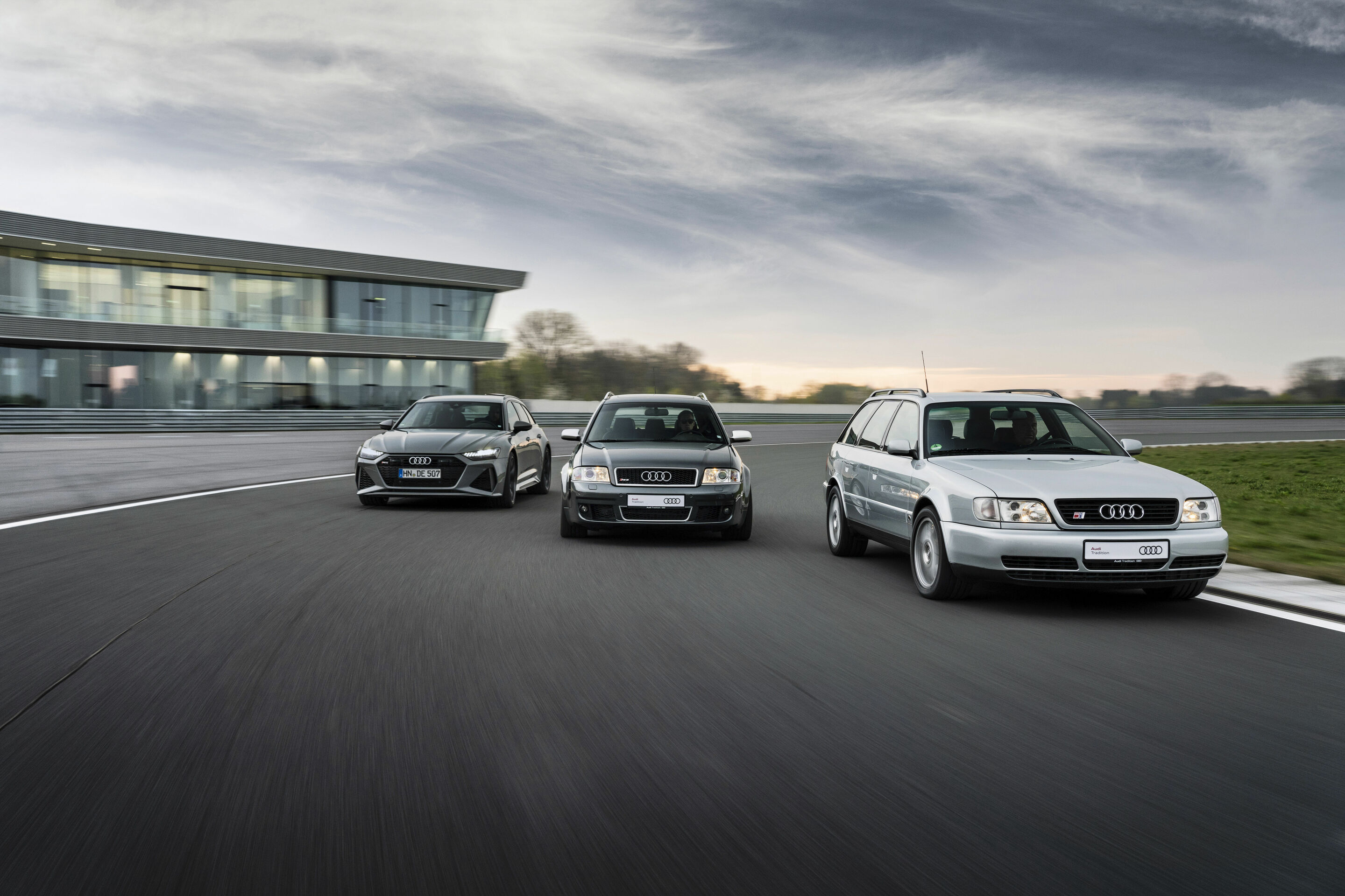 Peak sportiness - Three generations (from left to right): Audi RS 6 Avant performance (color: Nardo Gray), Audi RS 6 Avant (first generation), and Audi S6 plus
